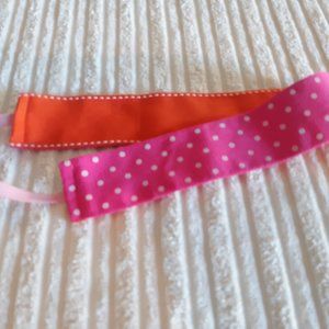 Off brand orange and pink headband average size reversible
